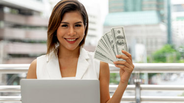 This image shows a woman holding money.