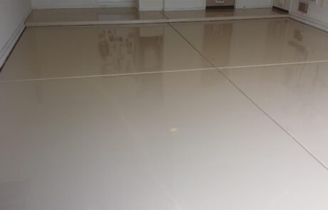 This image shows a garage with an epoxy floor.