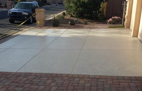 This image shows a driveway made up of flake epoxy flooring.