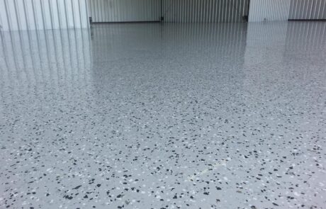 This image shows a warehouse with a flake epoxy floor.