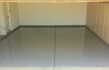 This image shows a garage with a flake epoxy floor.