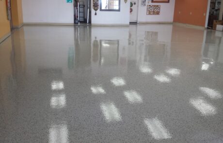 This image shows a garage with a flake epoxy floor.