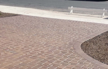 This image shows a driveway made up of stained pavers