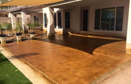 This image shows a pation that has a newly stained floor.