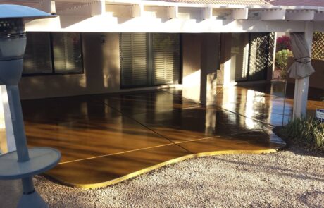 This image shows a patio that has a newly stained floor.