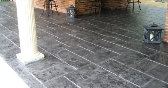 This image shows a patio with a stamped concrete floor.