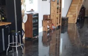 This image shows a living room floor that has a metallic epoxy floor.