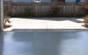 This image shows a garage that was painted with gray epoxy paint.