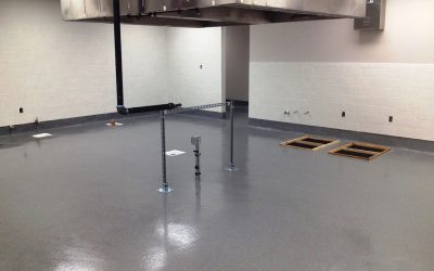 This image shows a commercial space that has a gray epoxy floor.