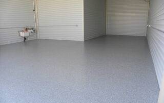 This image shows a commercial garage with flake epoxy floor.