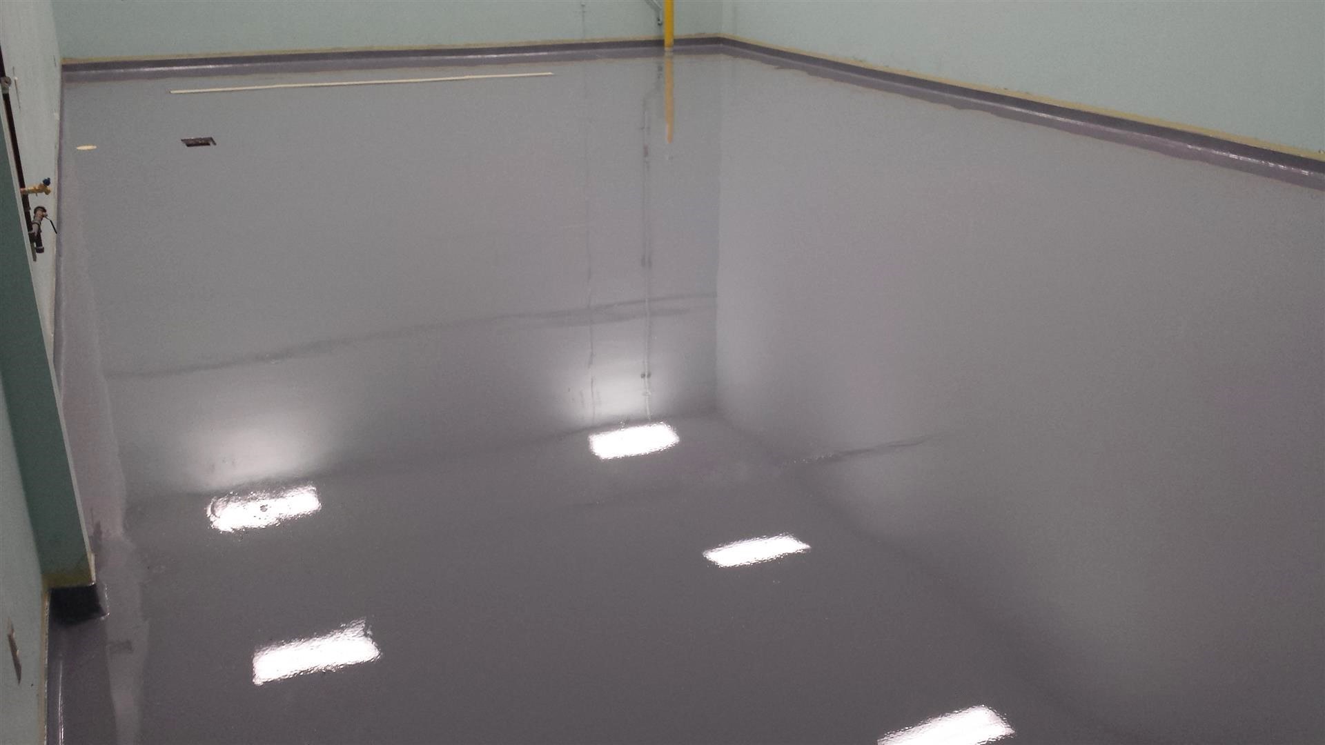 This image shows a floor that was newly painted with epoxy flooring.