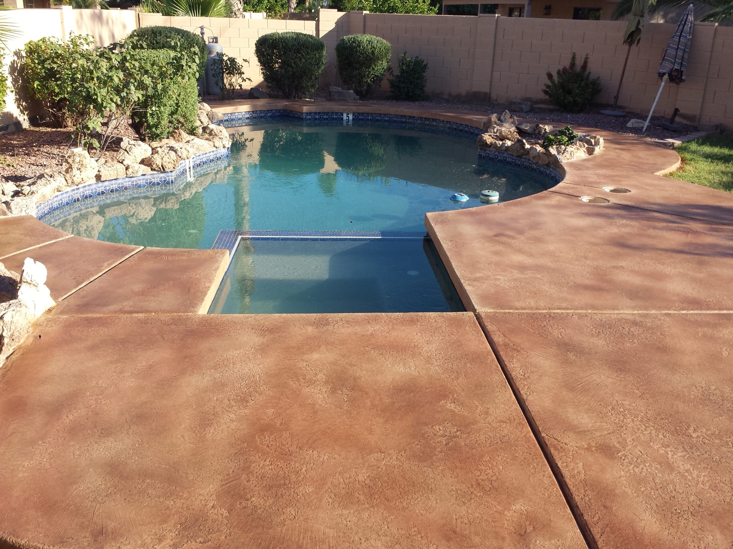 9_resort_garden_stained_concrete_patios