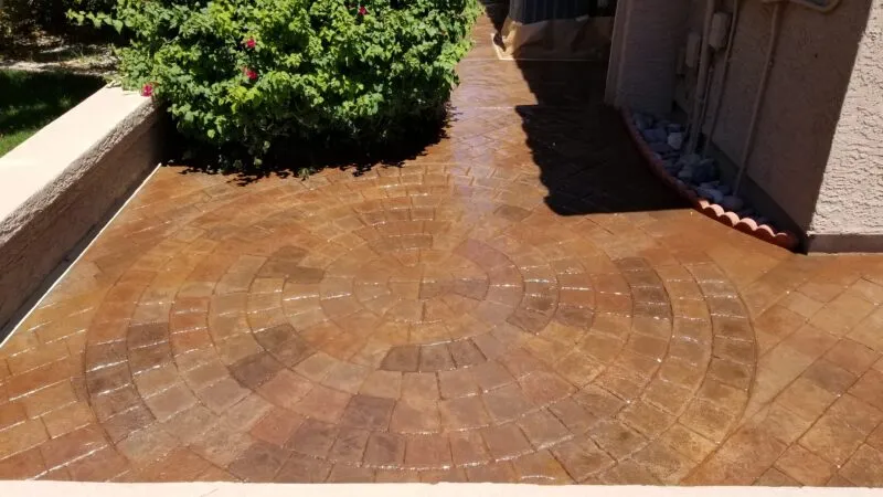 This image shows a pool deck made up of pavers