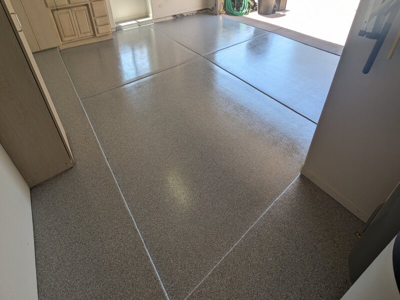 Garage Floor This image shows a garage floor with epoxy flake floor