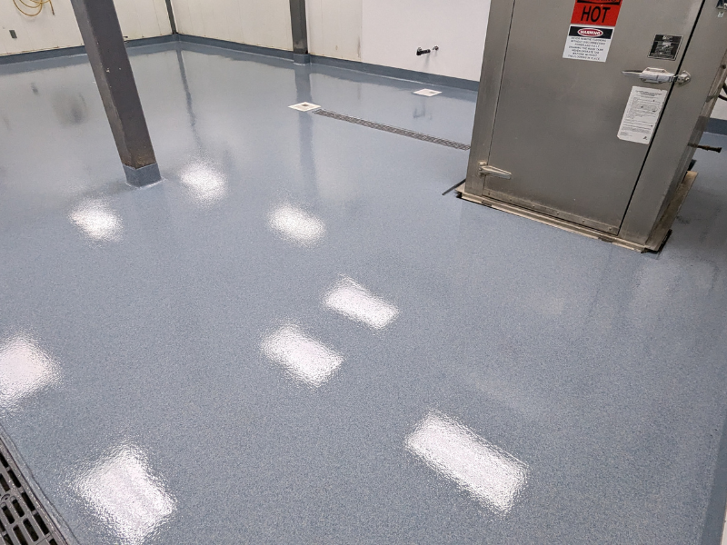 Epoxy Floor Repair This image shows a commercial space that is newly repaired
