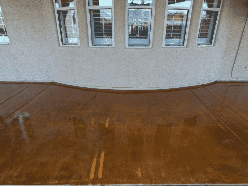 Stained Concrete Patio This image shows a pool deck made up of pavers