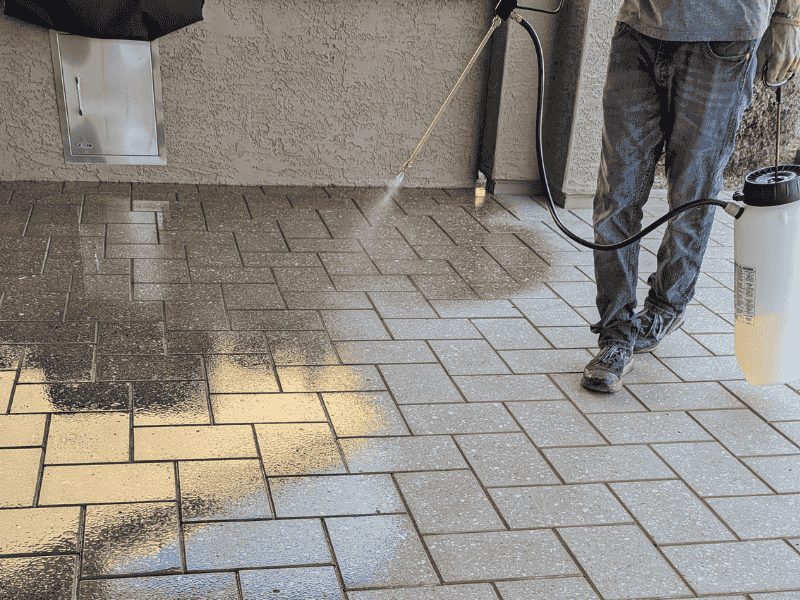 Concrete sealing This image shows a pool deck made up of pavers