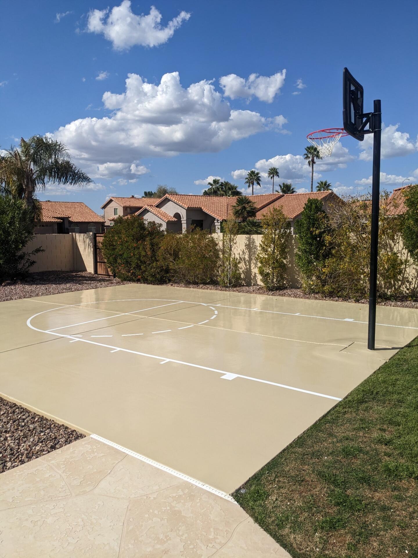 8. basketball court This image shows a driveway that was painted with epoxy